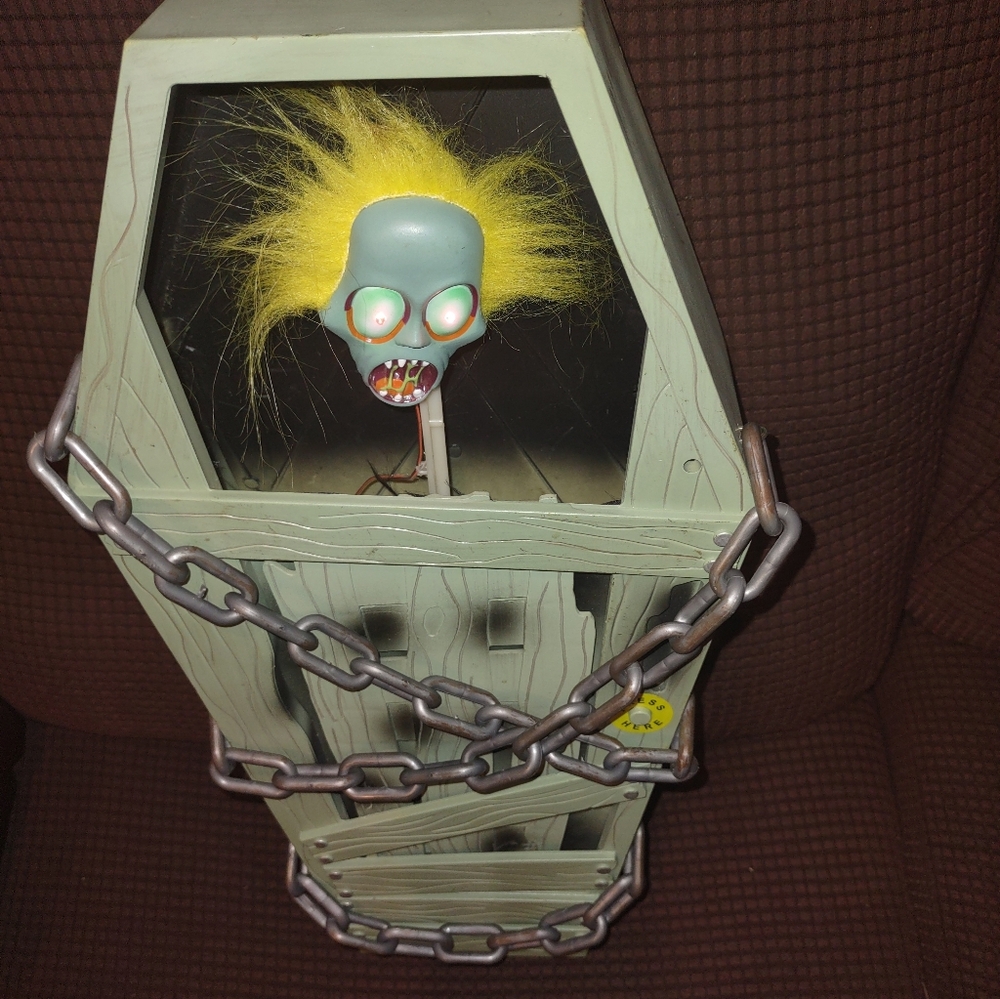 Creepy Animated Coffin with Light-Up Skull